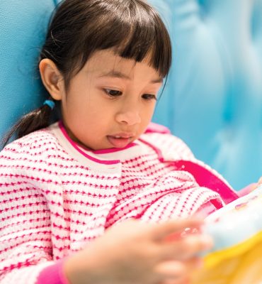 Asian kids play toys